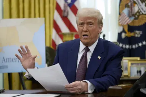 President Donald Trump speaks to reporters in the Oval Office of the White House, Feb. 13, 2025, in Washington. (AP Photo/Ben Curtis)