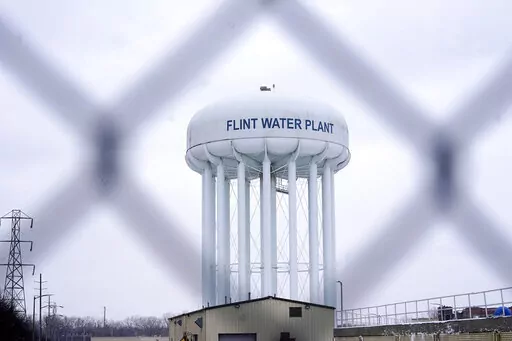 The Flint water plant tower is seen on Jan. 6, 2022, in Flint, Mich. A judge declared a mistrial Thursday, Aug. 11, after jurors said they couldn't reach a verdict in a dispute over whether two engineering firms should bear some responsibility for Flint's lead-contaminated water. Four families accused Veolia North America and Lockwood, Andrews & Newman, known as LAN, of not doing enough to get Flint to treat the highly corrosive water or to urge a return to a regional water supplier. (AP Photo/C