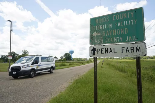 A Hinds County Sheriff's Department van passes the entrance to Hinds County Detention Facility, Aug. 1, 2022, in Raymond, Miss. Sheriff Tyree Jones said Monday, Oct. 16, 2023, that 200 inmates were removed from a part of the jail that has had security problems, and they were transferred to a privately run prison about two hours away. (AP Photo/Rogelio V. Solis, File)