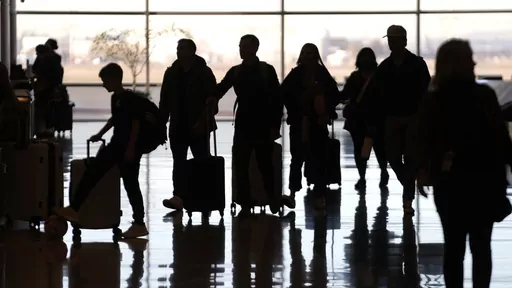 People pass through Salt Lake City International Airport on Wednesday, Jan. 11, 2023, in Salt Lake City. Thirty percent of Americans don't identify with a religious group — but not all of them are atheists or agnostics. In fact, 43% of the group known as the "nones" say they believe in God, even if they largely dislike organized religion. (AP Photo/Rick Bowmer, File)