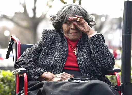 Autherine Lucy Foster reacts during the dedication ceremony for Autherine Lucy Foster Hall in Tuscaloosa, Ala., Friday, Feb. 25, 2022.  Angela Foster Dickerson, Foster's daughter, says her mother died Wednesday, March 2, 2022 and said a family statement would be released. (Gary Cosby Jr./The Tuscaloosa News via AP, File)