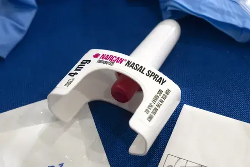 A container of Narcan, a brand name version of the opioid overdose-reversal drug naloxone, sits on a table following a demonstration at the Health and Human Services Humphrey Building on Friday, Sept. 8, 2023, in Washington. The number of U.S. fatal overdoses fell in 2023 — for only the second time since the current national epidemic of drug deaths began more than three decades ago. The Centers for Disease Control and Prevention posted the numbers on Wednesday, May 15, 2024. (AP Photo/Mark Sch