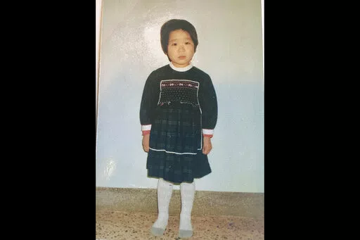 This undated photo provided by Joo-Rei Mathieson shows herself when she was in childhood taken in South Korea. A Brothers Home intake document describes Mathieson as a lost street kid brought in by police. It notes, chillingly for a government-sponsored vagrants' facility that survivors have told The Associated Press often worked children to death, that she's "capable of labor." She spoke no words for days, the document says, after entering Brothers, a now-destroyed facility in the southern port