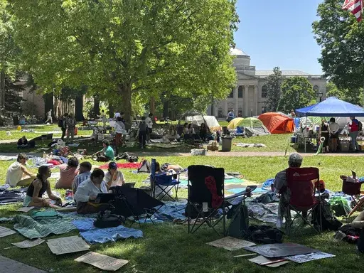 Students work on assignments and listen to organizers as they sit inside the encampment protest in Polk Place on University of North Carolina at Chapel Hill, N.C., April 29, 2024. On Monday, May 13, the University of North Carolina at Chapel Hill Board of Trustees approved a change that would divert $2.3 million of diversity funding to go toward public safety and policing. The vote to shift more funding to public safety comes as continued pro-Palestinian protests on UNC's campus have resulted in