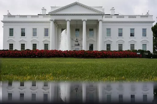 The White House is seen reflected in a puddle, Saturday, Sept. 3, 2022, in Washington. With roughly a year and a half until the 2024 presidential contest, the field of candidates is largely set. Former President Donald Trump and Florida Gov. Ron DeSantis have dominated the early Republican race, but other candidates including former Vice President Mike Pence, former United Nations Ambassador Nikki Haley and U.S. Sen. Tim Scott of South Carolina are looking for an opening in case either falters. 