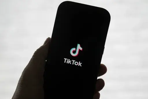 A TikTok logo is shown on a phone in San Francisco, Friday, Jan. 17, 2025. (AP Photo/Jeff Chiu, File)