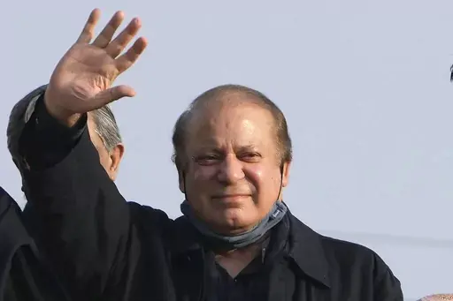 Pakistan's former Prime Minister Nawaz Sharif waves to his supporters as he arrives to address an election campaign rally in Hafizabad, Pakistan, Thursday, Jan. 18, 2024. Pakistan is holding elections for a new parliament on Thursday. No less than 44 political parties are vying for a share of the 266 seats that are up for grabs in the National Assembly, or the lower house of parliament, with an additional 70 seats reserved for women and minorities. (AP Photo/K.M. Chaudary, File)