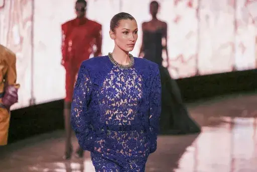 Bella Hadid wears a creation as part of the Saint Laurent Fall/Winter 2025-2026 Womenswear collection presented Tuesday, March 11, 2025. in Paris. (AP Photo/Thomas Padilla)