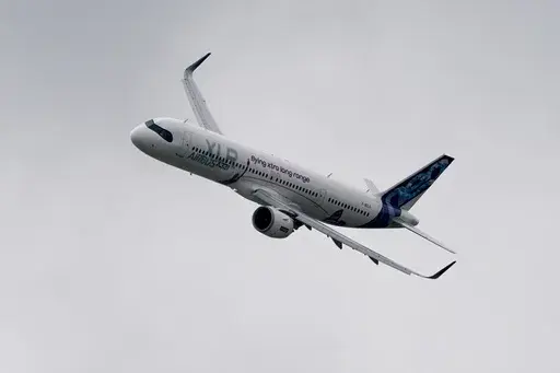 An Airbus A321-253 XLR flies, at the Farnborough International Air Show in Farnborough, England, Monday, July 22, 2024. (AP Photo/Alberto Pezzali)