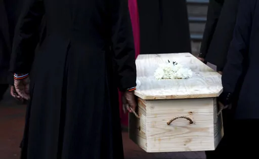 The coffin carrying Anglican Archbishop Emeritus Desmond Tutu is carried into the St. George's Cathedral Friday, Dec. 31, 2021 where he will lie in state for a second day in Cape Town, South Africa. Tutu, the Nobel Peace Prize-winning activist for racial equality and LGBT rights died Sunday at the age of 90. (AP Photo/Nardus Engelbrecht)