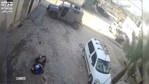 This image taken from video taken on Dec 8, 2023, in the Faraa refuge camp shows soldiers shooting down the men at close range when they did not appear to pose a threat. Security footage obtained by the Israeli human rights group B'Tselem shows two Israeli soldiers pursuing shooting the men — one while he was incapacitated and the other appearing to be unarmed — during a raid in a West Bank refugee camp. (B'Tselem via AP)