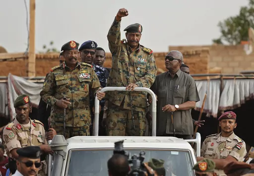 Sudanese Gen. Abdel-Fattah Burhan, head of the military council, waves to his supporters upon his arrival to attend a military-backed rally, in Omdurman district, west of Khartoum, Sudan, Saturday, June 29, 2019.(AP Photo/Hussein Malla, File)
