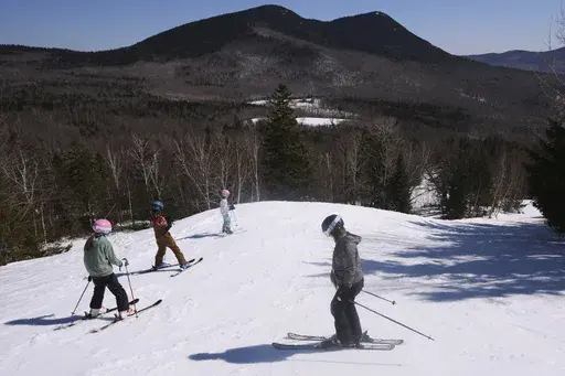 Skiers head down a trail at Black Mountain, Friday, March 14, 2025, in Jackson, N.H. (AP Photo/Charles Krupa)