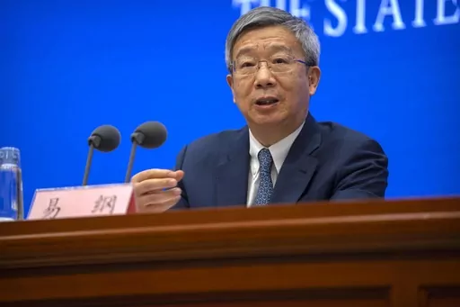 Yi Gang, governor of the People's Bank of China, speaks during a press conference at the State Council Information Office in Beijing, on March 3, 2023. China on Sunday, March 12, reappointed Yi as head of the central bank in an effort to reassure entrepreneurs and financial markets by showing continuity at the top while other economic officials change. (AP Photo/Mark Schiefelbein, File)
