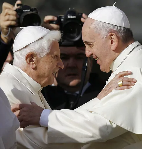 Pope Francis, right, hugs Pope Emeritus Benedict XVI prior to the start of a meeting with elderly faithful in St. Peter's Square at the Vatican, Sunday, Sept. 28, 2014. Pope Francis on Wednesday, Dec. 28, 2022, said his predecessor, Pope Emeritus Benedict XVI, is “very sick," and he asked the faithful to pray for the retired pontiff so God will comfort him “to the very end.” (AP Photo/Gregorio Borgia, File)