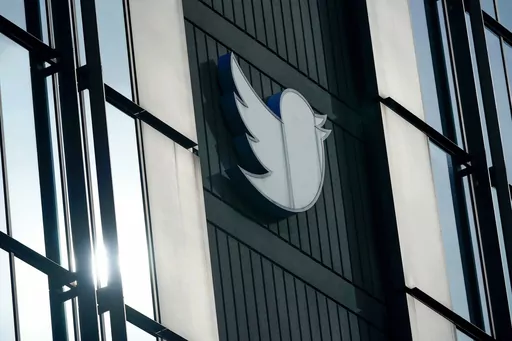 A Twitter logo hangs outside the company's offices in San Francisco, on Dec. 19, 2022. Russia, China and Iran are exploiting recent changes at Twitter to spread disinformation faster and farther. Under new owner Elon Musk, Twitter recently ended its policy of labeling foreign propaganda agencies like RT or Sputnik. (AP Photo/Jeff Chiu, File)