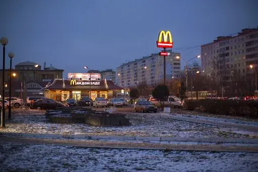 McDonald's restaurant is seen in the center of Dmitrov, a Russian town 75 km., (47 miles) north from Moscow, Russia, on Dec. 6, 2014. McDonald’s says it's started the process of selling its Russian business, which includes 850 restaurants that employ 62,000 people. The fast food giant pointed to the humanitarian crisis caused by the war, saying holding on to its business in Russia “is no longer tenable, nor is it consistent with McDonald’s values.” The Chicago-based company had temporari
