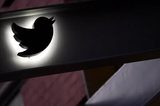 The Twitter logo is seen on the awning of the building that houses the Twitter office in New York, Wednesday, Oct. 26, 2022.  While amount of chaos is expected after a corporate takeover, as are layoffs and firings, Elon Musk’s murky plans for Twitter — especially its content moderation, misinformation and hate speech policies — are raising alarms about where one of the world’s most high-profile information ecosystems is headed.   (AP Photo/Mary Altaffer, File)