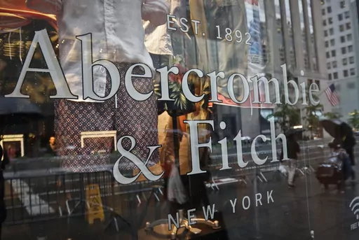 In this May 22, 2017, file photo, a store window reflects a street scene at an Abercrombie & Fitch store on New York's Fifth Avenue. A former model for Abercrombie & Fitch has sued the fashion retailer, Friday, Oct. 27, 2023, alleging it allowed its former CEO Mike Jeffries to run a sex-trafficking organization during his 22-year tenure.(AP Photo/Bebeto Matthews, File)