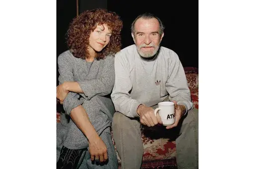 Actress Amy Irving sits with actor-director-playwright Athol Fugard during rehearsals of the play "The Road to Mecca" on Feb. 29, 1988 in New York. (AP Photo/Mario Cabrera, File)