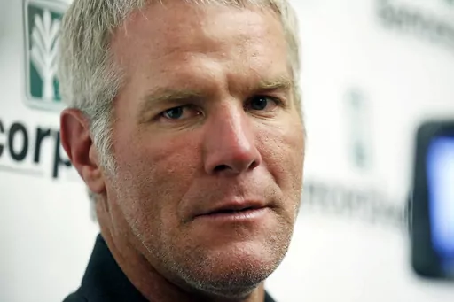 Former NFL football quarterback Brett Favre speaks with reporters prior to his induction to the Mississippi Hall of Fame, Aug. 1, 2015, in Jackson, Miss. On Monday, Oct. 30, 2023, a federal judge dismissed Favre’s defamation lawsuit against fellow retired NFL player Shannon Sharpe. (AP Photo/Rogelio V. Solis, File)