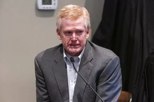 Defendant Alex Murdaugh is cross examined by prosecutor Creighton Waters while testifying during his murder trial at the Colleton County Courthouse in Walterboro, S.C., Friday, Feb. 24, 2023. The 54-year-old attorney is standing trial on two counts of murder in the shootings of his wife and son at their Colleton County, S.C., home and hunting lodge on June 7, 2021. (Joshua Boucher/The State via AP, Pool)
