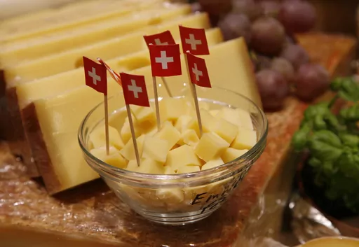 Cheese from Switzerland is presented at the fair eat'n Style in Cologne, Germany, on Friday, Nov. 14, 2008. The head of the Switzerland's dairy association SMP says the country will import more cheese than it exports this year for the first time. (AP Photo/Hermann J. Knippertz, File)