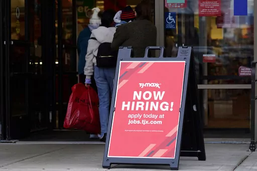 Hiring sign is displayed outside of a retail store in Vernon Hills, Ill., on Nov. 13, 2021. Fewer Americans applied for jobless aid last week with the number of Americans collecting unemployment at historically low levels. Applications for unemployment benefits fell by 11,000 to 200,000 for the week ending May 28, the Labor Department reported Thursday, June 2, 2022. First-time applications generally track the number of layoffs. (AP Photo/Nam Y. Huh, File)
