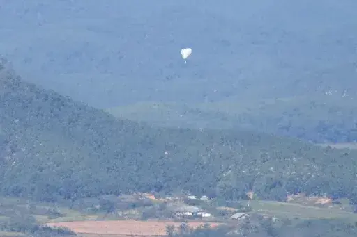 North Korean balloons are seen from the Unification Observation Post in Paju, South Korea, near the border with North Korea, on Oct. 4, 2024. (AP Photo/Lee Jin-man, File)