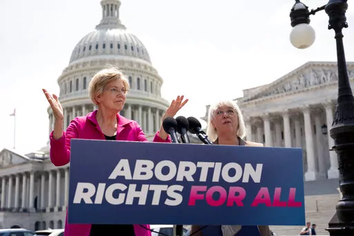 Sen. Elizabeth Warren, D-Mass., and Sen. Patty Murray, D-Wash., talk to reporters as the Supreme Court is poised to possibly overturn Roe v. Wade, at the Capitol in Washington, June 15, 2022.  The Democratic National Committee is launching a digital ad campaign to energize its voters after last month’s Supreme Court decision overturning Roe v. Wade. The ad campaign warns that Republicans’ ultimate goal is to outlaw abortion nationwide.  (AP Photo/J. Scott Applewhite, File)