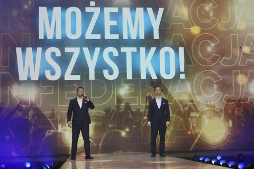 Slawomir Mentzen, left, and Krzysztof Bosak, right, the co-leaders of the hard right Confederation party, present their party slogan "Mozemy Wszystko!" (We Can Do Anything) at a convention in Katowice, Poland, on Saturday, Sept. 23, 2023. Confederation has been growing in popularity, especially among young men. The party has been riding a wave of growing support for far-right parties across Europe, and polls show it could increase its presence in parliament in a national election Oct. 15. No mat