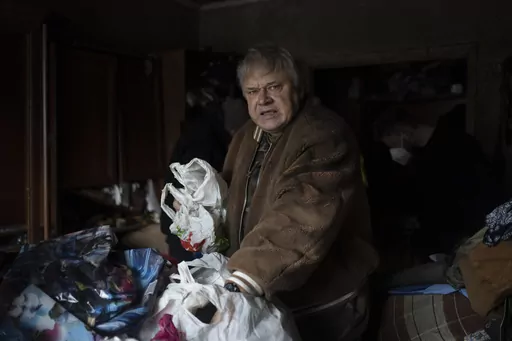 Serhii Slobodiannyk, 63, stands inside of his apartment that was damaged as a result of Russia's attack on Jan. 2 in Kyiv, Ukraine, Wednesday, Jan. 3, 2024. "Everything I worked for over 30 years was destroyed in less than a second," he says. (AP Photo/Hanna Arhirova)