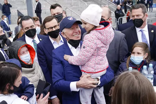President Joe Biden meets with Ukrainian refugees during a visit to PGE Narodowy Stadium, March 26, 2022, in Warsaw. The Biden administration is making it easier for refugees fleeing Russia’s war on Ukraine to come to the United States from Europe while trying to shut down an informal route through Northern Mexico that has emerged in recent weeks.  (AP Photo/Evan Vucci, File)