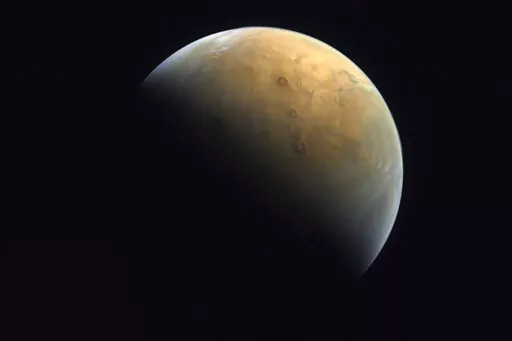 This image captured by the United Arab Emirates' "Amal" ("Hope") probe shows the planet Mars on Feb. 10, 2021. Ancient Mars may have had an environment capable of harboring an underground world teeming with microscopic organisms. That's according to French scientists who published their findings Monday, Oct. 10, 2022. (Mohammed bin Rashid Space Center/UAE Space Agency, via AP, File)