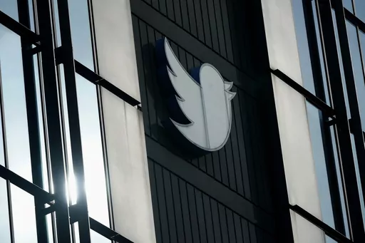 A Twitter logo hangs outside the company's offices in San Francisco, on Dec. 19, 2022. The Canadian Broadcasting Corporation paused its use of Twitter on Monday, April 17, 2023, after the social media platform owned by Elon Musk stamped CBC’s account with a label the public broadcaster says is intended to undermine its credibility. (AP Photo/Jeff Chiu, File)