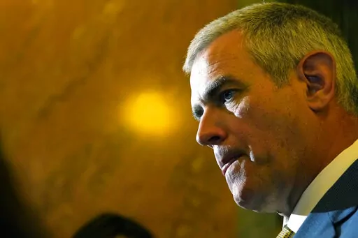 House Speaker Philip Gunn, R-Clinton listens to reporters following adjournment of the body on the first day of the 90-day Legislative Session at the Capitol in Jackson, Miss., Tuesday, Jan. 4, 2022. (AP Photo/Rogelio V. Solis)