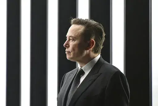 Elon Musk, Tesla CEO, attends the opening of the Tesla factory Berlin Brandenburg in Gruenheide, Germany, March 22, 2022. Elon Musk will be able to include new evidence from a Twitter whistleblower as he fights to get out of his $44 billion deal to buy the social media company, but Musk won’t be able to delay a high-stakes October trial over the dispute, a judge ruled Wednesday, Sept. 7, 2022. (Patrick Pleul/Pool via AP)