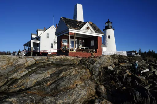 The iconic bell tower building at Pemaquid Point Light stands with makeshift modifications, Thursday, Jan. 11, 2024, in Bristol, Maine, the day after being pummeled by damaging winds and waves from powerful storm. The lighthouse represents Maine on its state quarter. (AP Photo/Robert F. Bukaty)