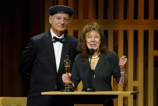 Bill Murray, left, presents Elaine May with an honorary award at the Governors Awards on Friday, March 25, 2022, at the Dolby Ballroom in Los Angeles. (AP Photo/Chris Pizzello)