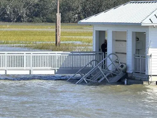 A portion of the collapsed gangway remains visible on Sapelo Island in McIntosh County, Ga., on Sunday, Oct. 20, 2024. (AP Photo/Lewis Levine, File)