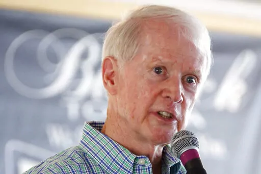 Central District Transportation Commissioner Dick Hall explains his agency's needs for updating and maintaining the state's roads as an attraction for incoming businesses before a morning audience in the pavilion at Founders Square at the Neshoba County Fair., Wednesday, July 27, 2016, in Philadelphia, Miss.  Hall, a former Mississippi transportation commissioner who was one of the state's longest-serving public officials, has died. He was 84.   (AP Photo/Rogelio V. Solis, File