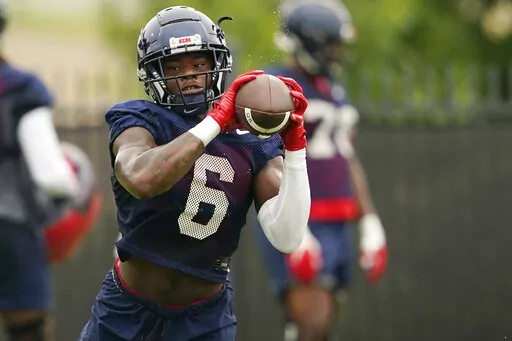 Mississippi running back Zach Evans (6) pulls in a pass during an NCAA college football practice on Aug. 3, 2022, in Oxford, Miss. Evans, a former five-star prospect, ran for 684 yards and five touchdowns in six games last season. (AP Photo/Rogelio V. Solis, File)