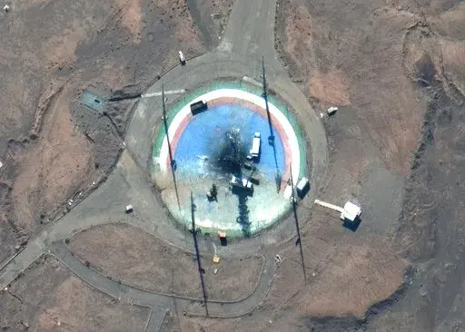 In this satellite photo from Maxar Technologies, trucks and other equipment surround a scorched launch pad at Iran's Imam Khomeini Spaceport in rural Semnan province Sunday, Feb. 27, 2022. Iran likely suffered another failed launch of a satellite-carrying rocket in recent days, attempting to reinvigorate a program criticized by the West even as Tehran faces last-minute negotiations with world powers to save its tattered nuclear deal in Vienna. (Satellite image ©2022 Maxar Technologies via AP)