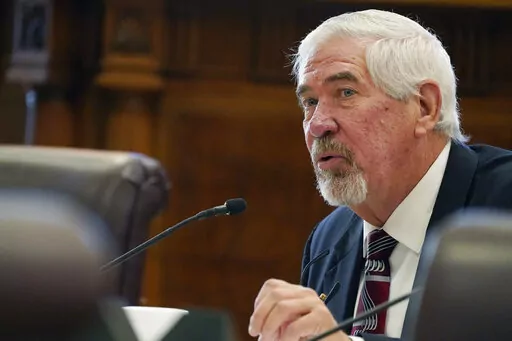 Mississippi Senate Medicaid Committee Chairman Kevin Blackwell, R-Southaven, asks a question of Dr. Anita Henderson, president of the Mississippi Chapter of the American Academy of Pediatrics, during a hearing, Dec. 1, 2022, at the state Capitol in Jackson, Miss. Mississippi state senators passed a bill on Tuesday, Feb. 7, 2023, that would let mothers keep Medicaid coverage for a year after giving birth, up from the current two months. (AP Photo/Rogelio V. Solis, File)