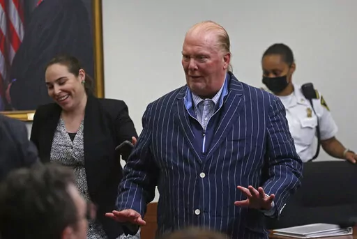 Celebrity chef Mario Batali reacts after being found not guilty of indecent assault and battery at Boston Municipal Court on the second day of his trial, on Tuesday, May 10, 2022 in Boston.  Batali, who pleaded not guilty to indecent assault and battery in 2019, had faced up to 2 1/2 years in jail and would’ve been required to register as a sex offender if convicted.  (Stuart Cahill/The Boston Herald via AP, Pool)