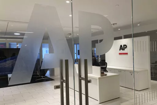The Associated Press logo is shown at the entrance to the news organization's office in New York on Thursday, July 13, 2023. The Associated Press has issued guidelines for its journalists on use of artificial intelligence, saying the tool cannot be used to create publishable content and images for the news service. (AP Photo/Aaron Jackson, File