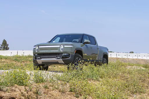 This photo provided by Rivian shows the R1T, one of the first electric pickup trucks to hit the U.S. market. (Rex Tokeshi-Torres/Rivian/Edmunds via AP)