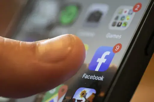 An iPhone displays the Facebook app, Aug. 11, 2019, in New Orleans. Russia, China and Iran are continuing to target voters in the U.S. with disinformation and propaganda related to the upcoming presidential election, top intelligence officials told reporters on Monday, July 29, 2024. Groups linked to the Kremlin are increasingly using private public relations firms or unwitting social media users to spread their false claims as a way to hide their tracks. (AP Photo/Jenny Kane, File)