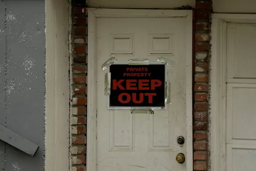 A keep out sign is posted on a home, Wednesday, April 19, 2023, near the house where 84-year-old Andrew Lester shot 16-year-old Ralph Yarl a week earlier in Kansas City, Mo. (AP Photo/Charlie Riedel, File)