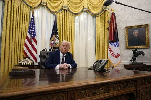 President Donald Trump answers questions from reporters as he signs an executive orders in the Oval Office of the White House, Jan. 23, 2025, in Washington. (AP Photo/Ben Curtis, File)